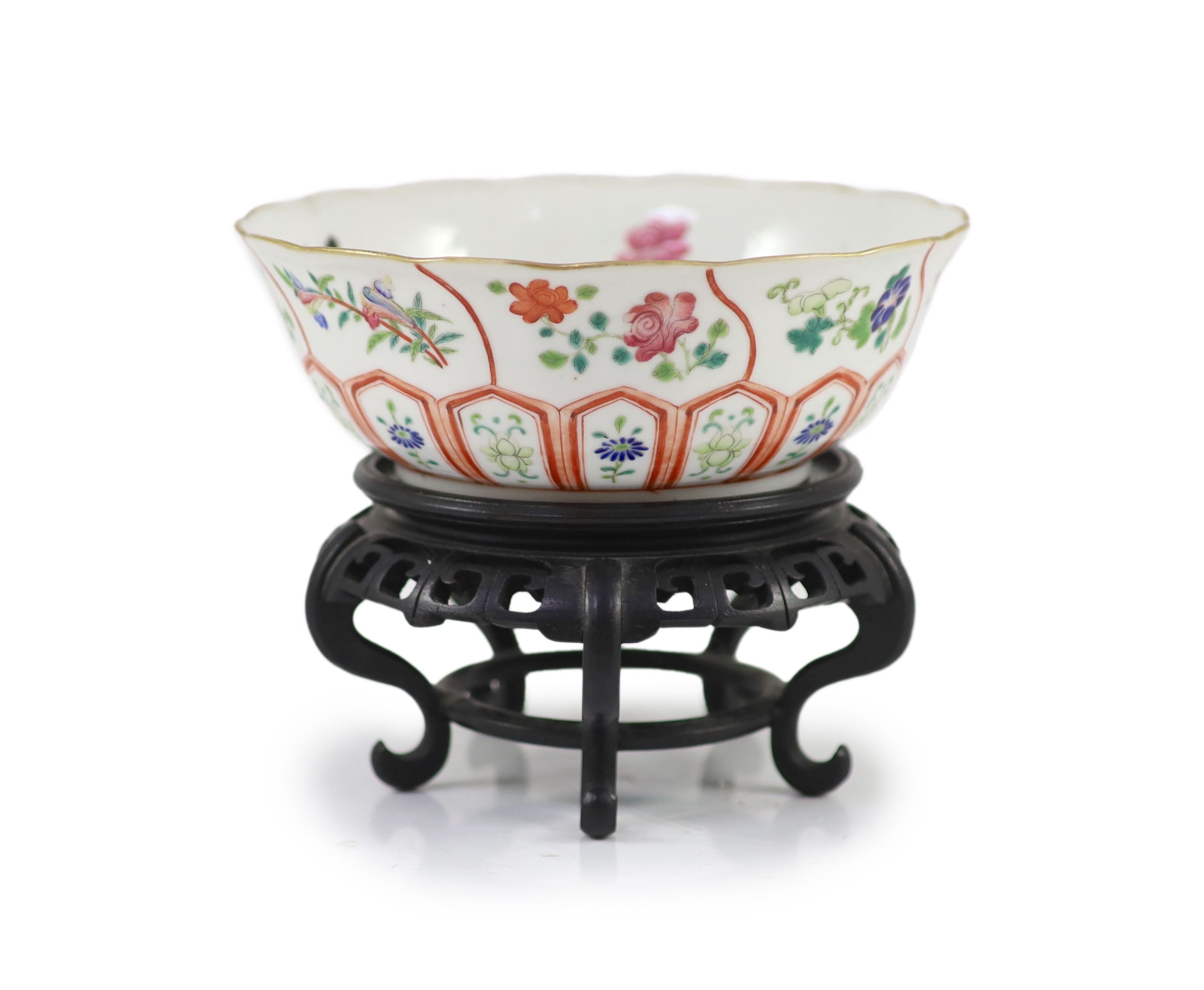 A Chinese famille rose bowl, Daoguang seal mark and of the period (1821-50), 17.8cm diameter, wood stand